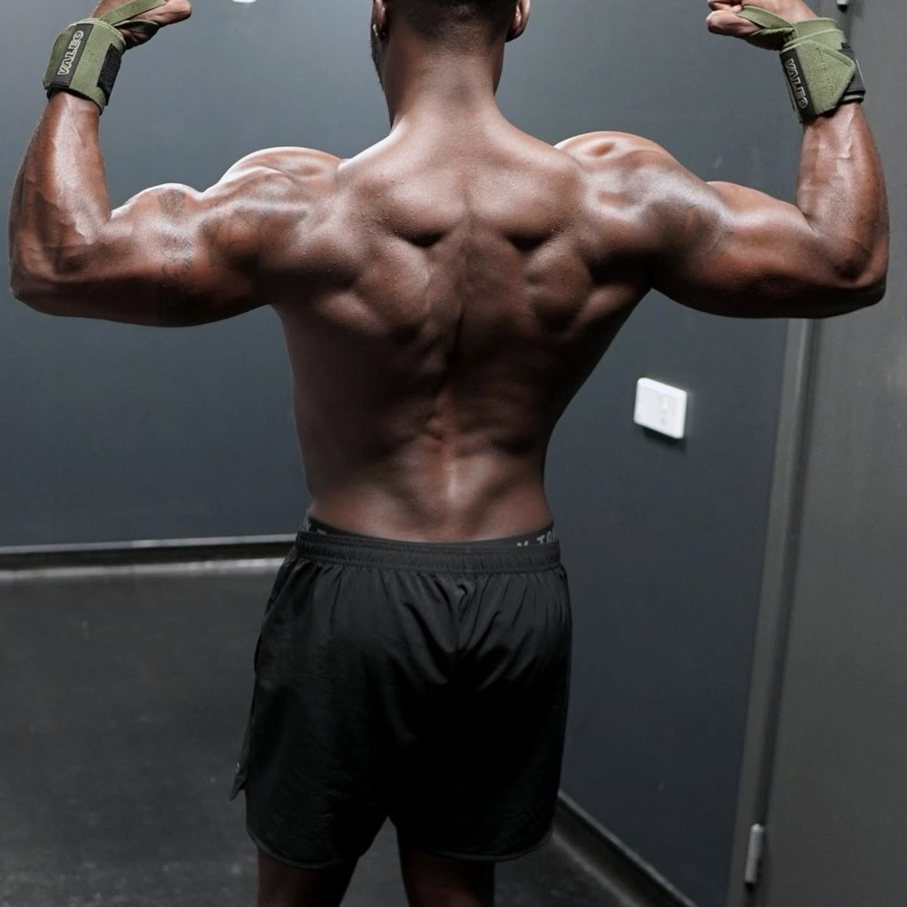 Back pose detail showing olive wrist wraps